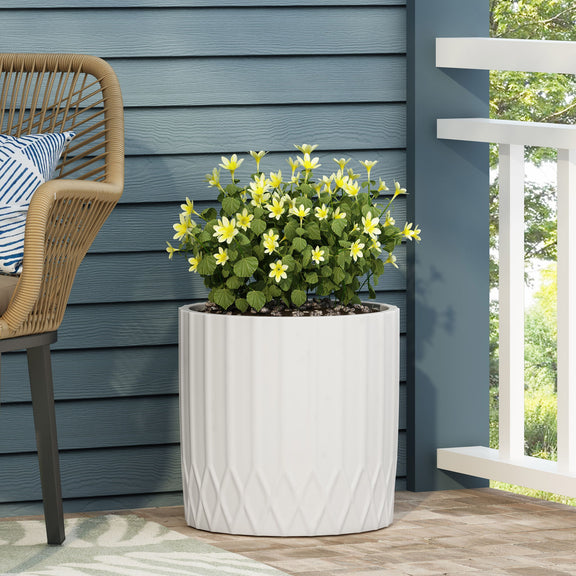 Antique white outdoor planter with diamond pleated pattern and top rim