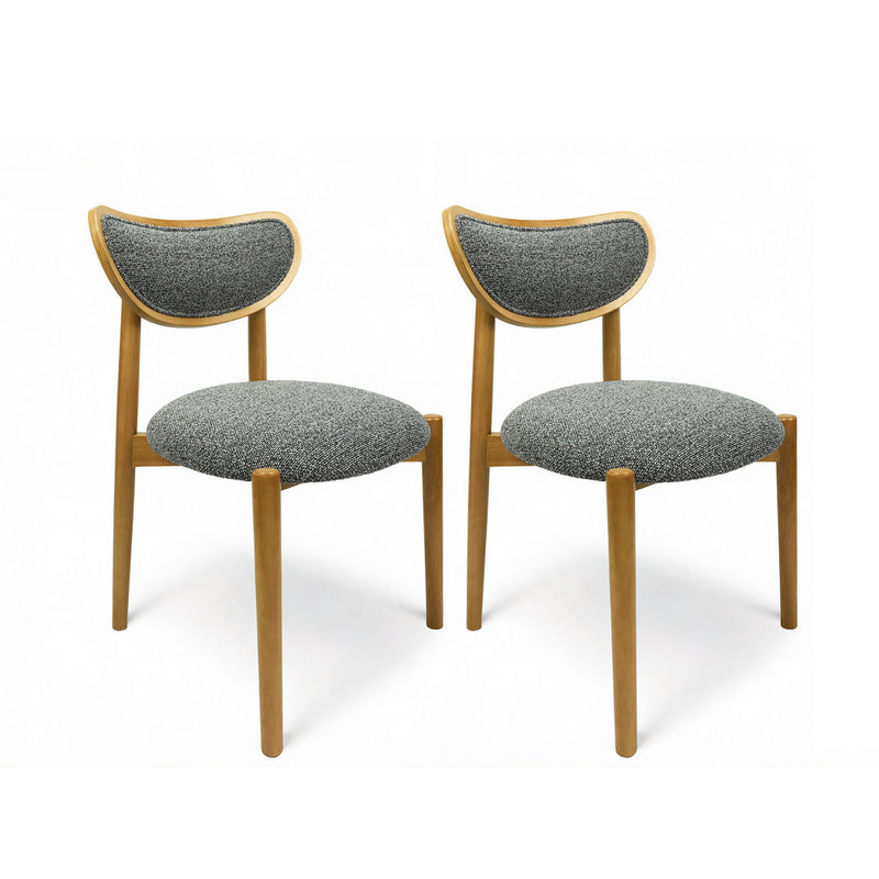 Pair of dark gray upholstered dining chairs with curved backs and wood frames