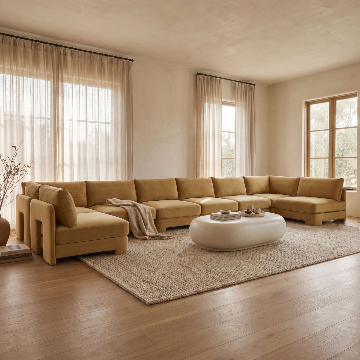 Tan velvet armless sectional sofa with chaise and tufted seat cushions