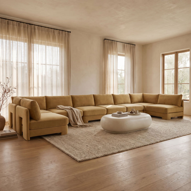 Tan velvet armless sectional sofa with chaise and tufted seat cushions