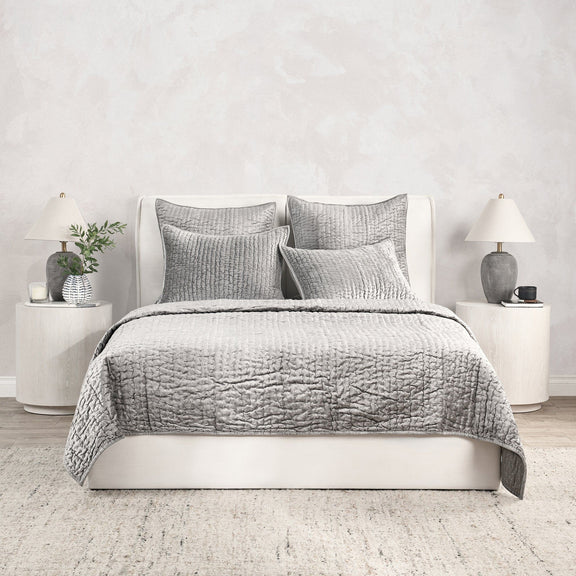 Gray velvet quilt set with matching shams and decorative pillows