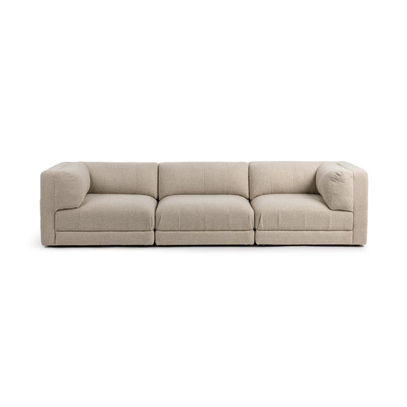 Beige 3-piece sectional sofa with three seat cushions and deep chaise blocks