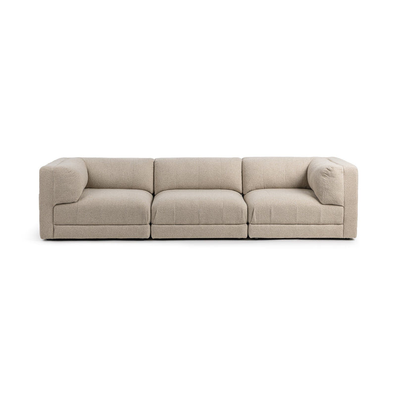 Beige 3-piece sectional sofa with three seat cushions and deep chaise blocks