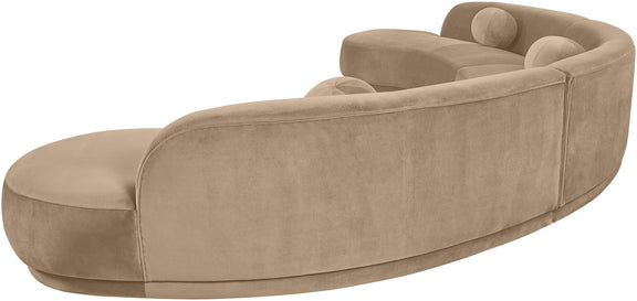 Beige velvet upholstered sectional chaise with curved back and rounded armrests