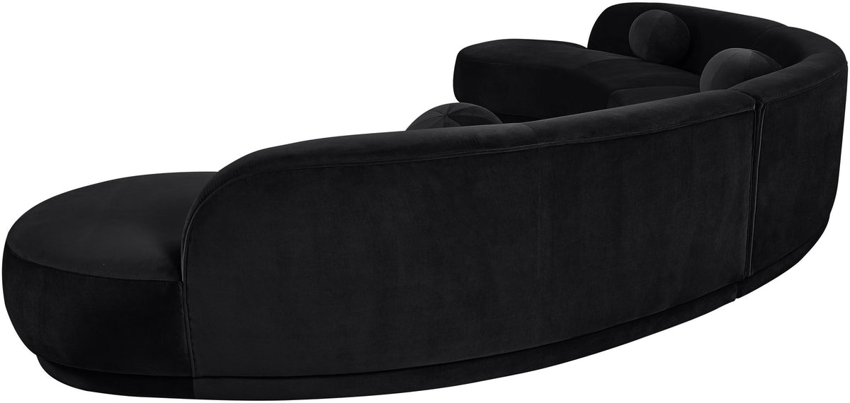 Black velvet upholstered sectional chaise with curved back and rounded seat cushions