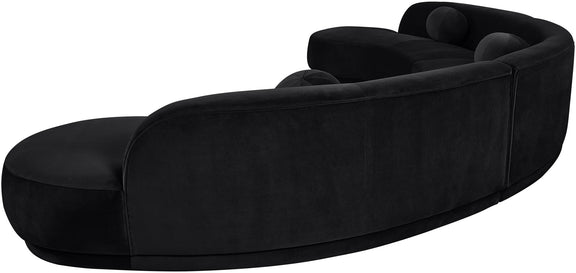 Black velvet upholstered sectional chaise with curved back and rounded seat cushions