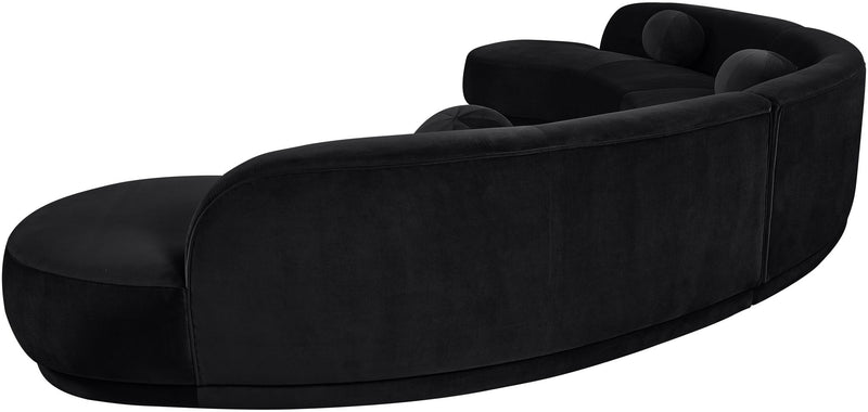 Black velvet upholstered sectional chaise with curved back and rounded seat cushions
