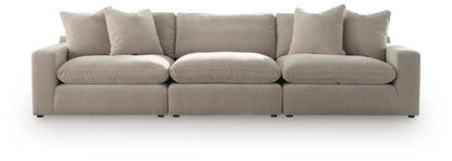 Beige 3-seat sectional sofa with four back pillows and three wide seat cushions