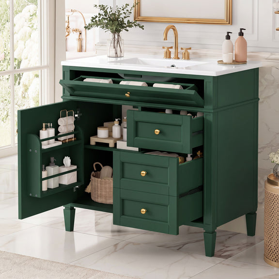 Dark green vanity opened to show tip-out drawer, cabinet shelves and three pull-out drawers