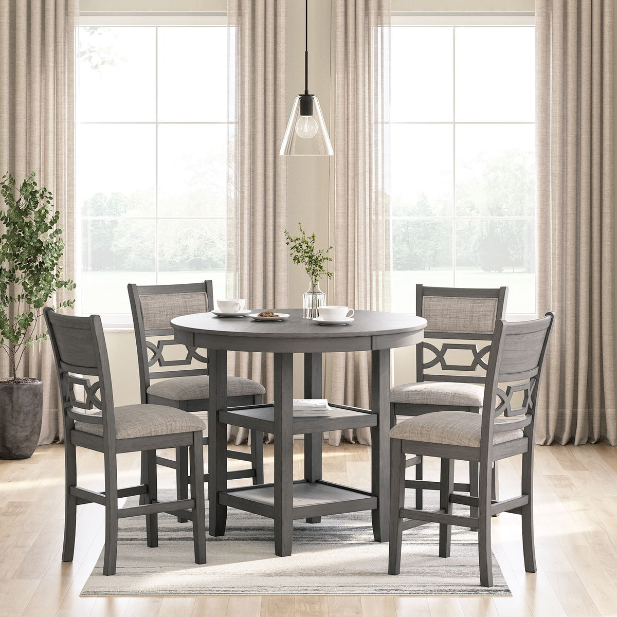 Gray counter table set with four stools in a dining room setting