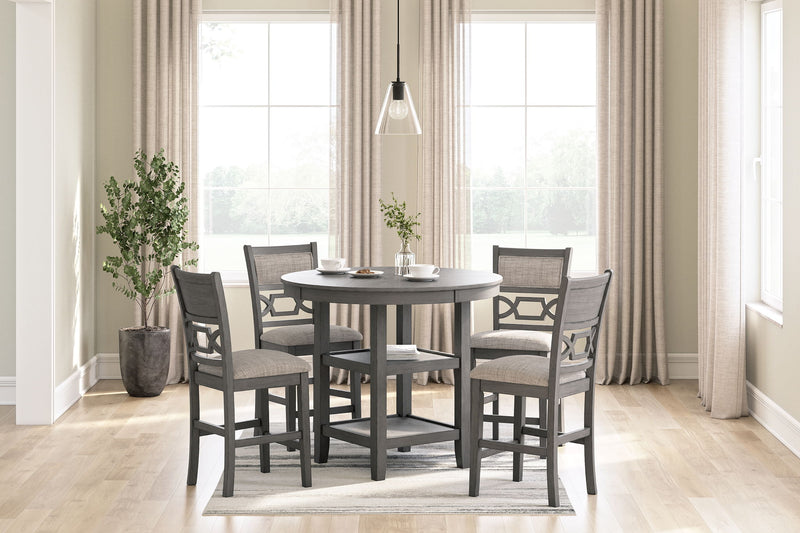 Gray counter table set with four stools in a dining room setting