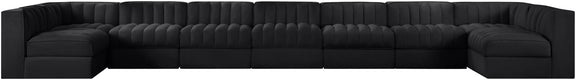 Black armless velvet modular sectional with tufted back and wide chaise seating