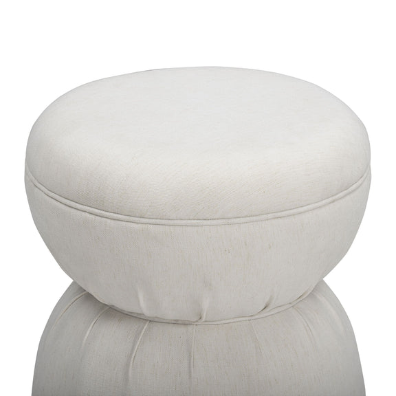 White ruched upholstered ottoman with round padded top and stacked base