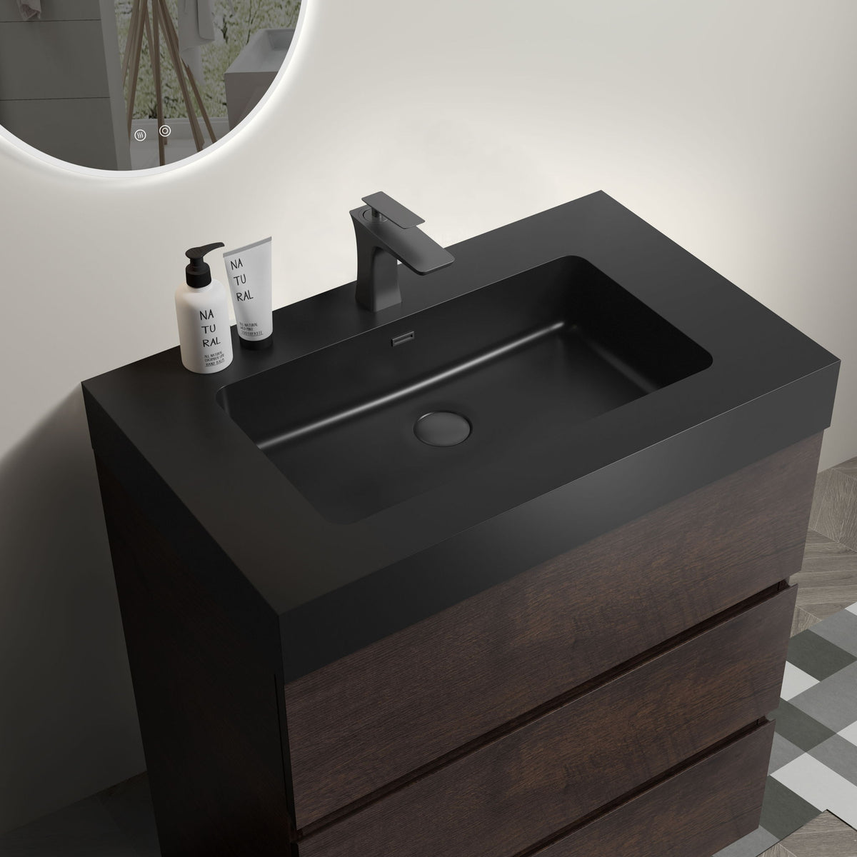 Freestanding bathroom vanity with black sink basin, tall faucet, dark wood cabinet drawers