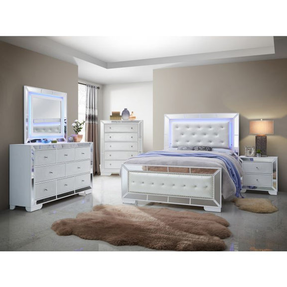 Modern queen bed with tufted light-gray headboard, white frame, and paneled footboard