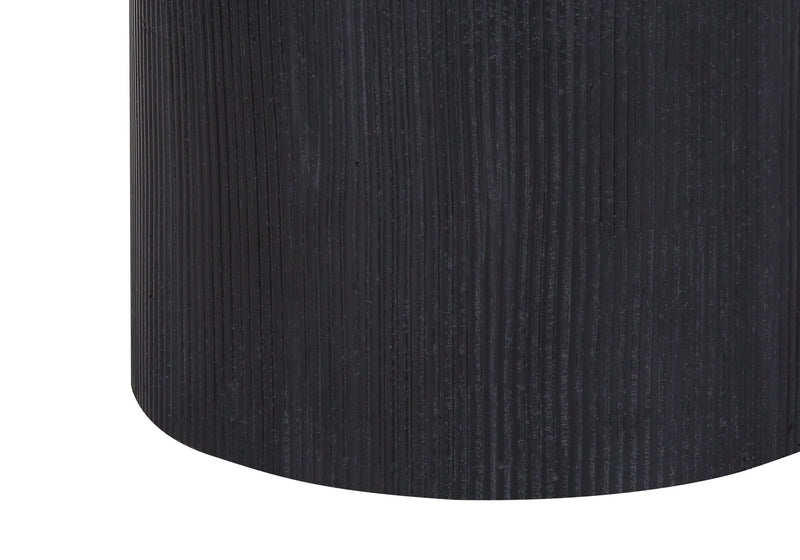 Close-up of dark textured concrete lamp base with vertical ribbing