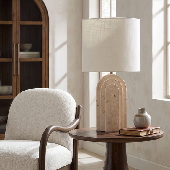 Caldera table lamp with white fabric shade and arched stone-texture base