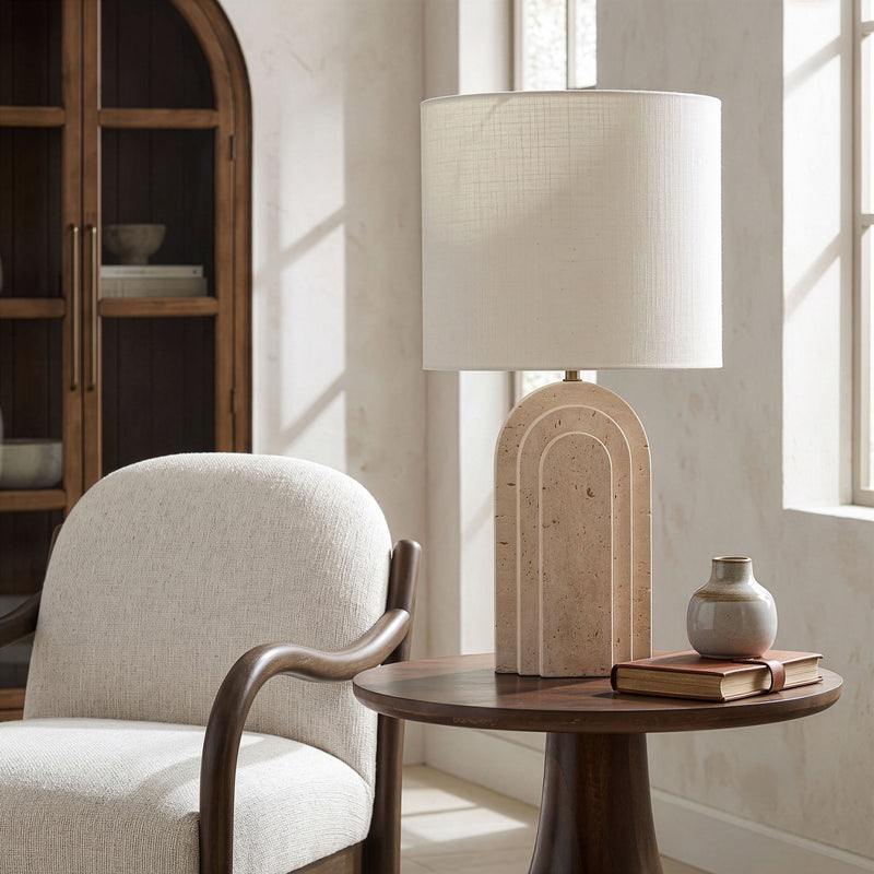 Caldera table lamp with white fabric shade and arched stone-texture base