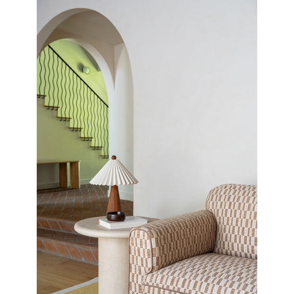 Taupe patterned sofa with rolled arms and thick seat cushion, angled view