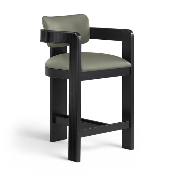 Green vegan leather counter stool with padded seat, fluted back panel, black frame