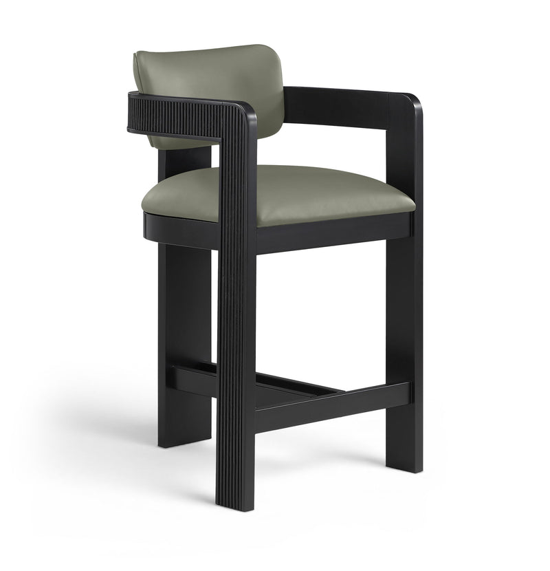 Green vegan leather counter stool with padded seat, fluted back panel, black frame