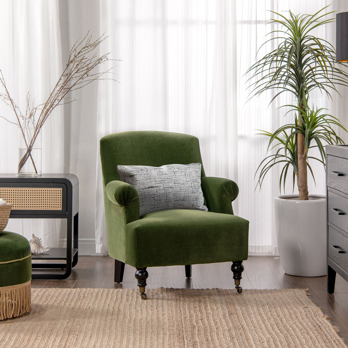 Green upholstered accent armchair with rolled arms and pleated sock-style sides