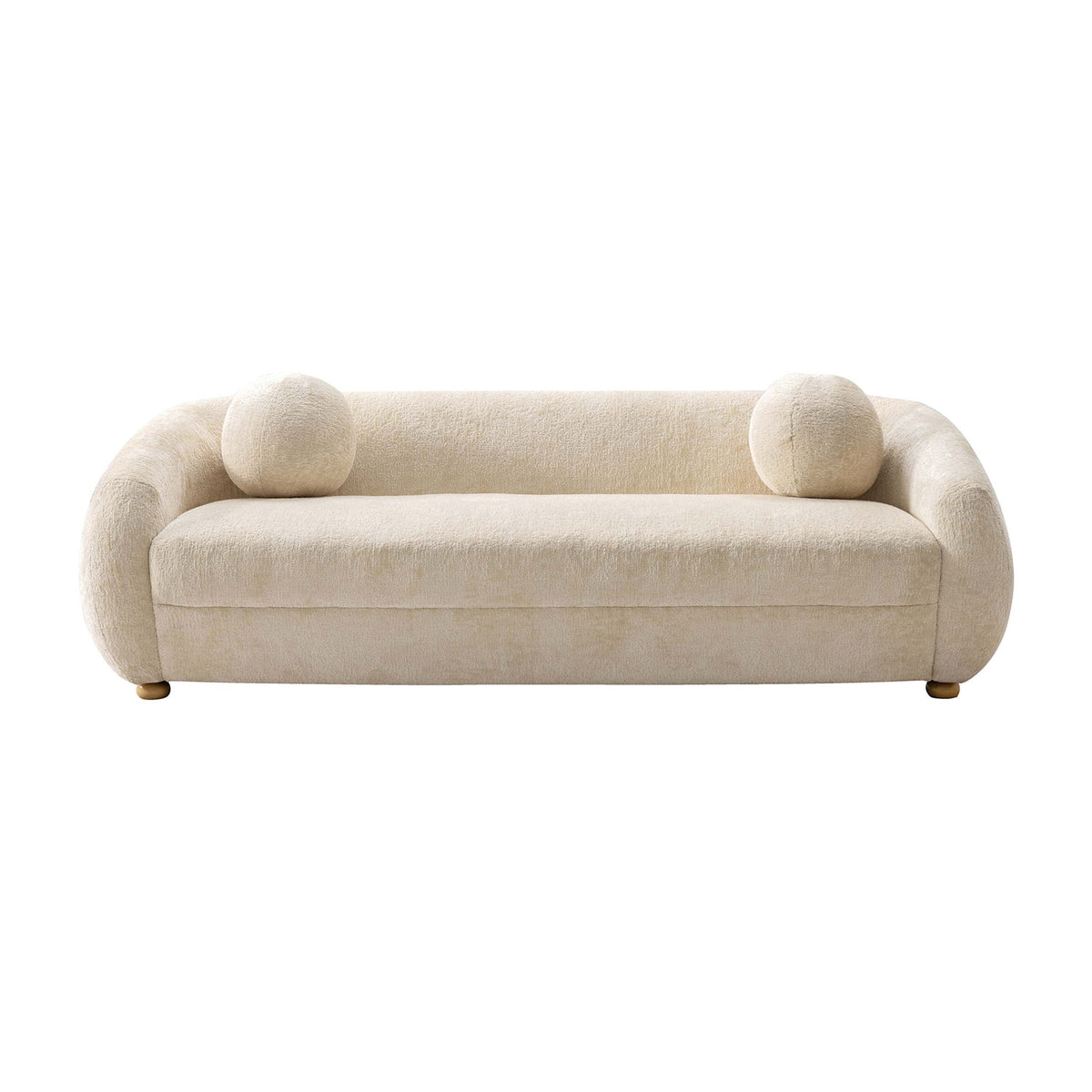 Beige upholstered sofa with rounded arms and two round accent pillows