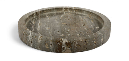 Gray travertine round tray with a shallow bowl and speckled stone surface.