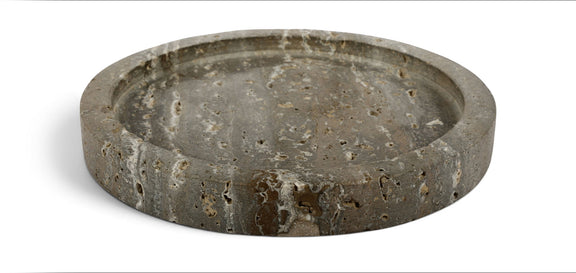 Gray travertine round tray with a shallow bowl and speckled stone surface.