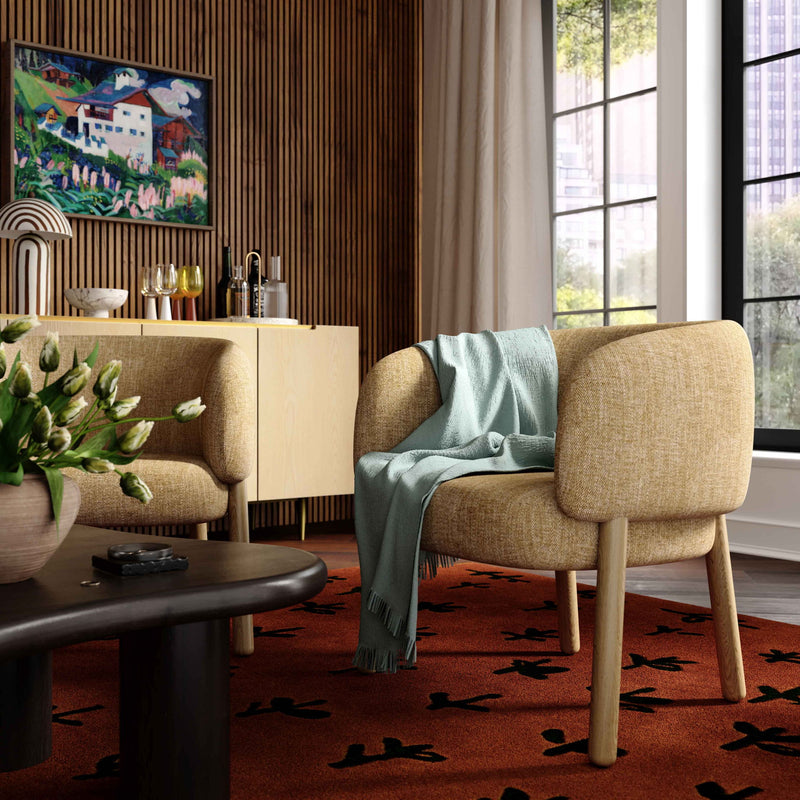 Beige upholstered accent chair with curved back and armrests, wooden legs