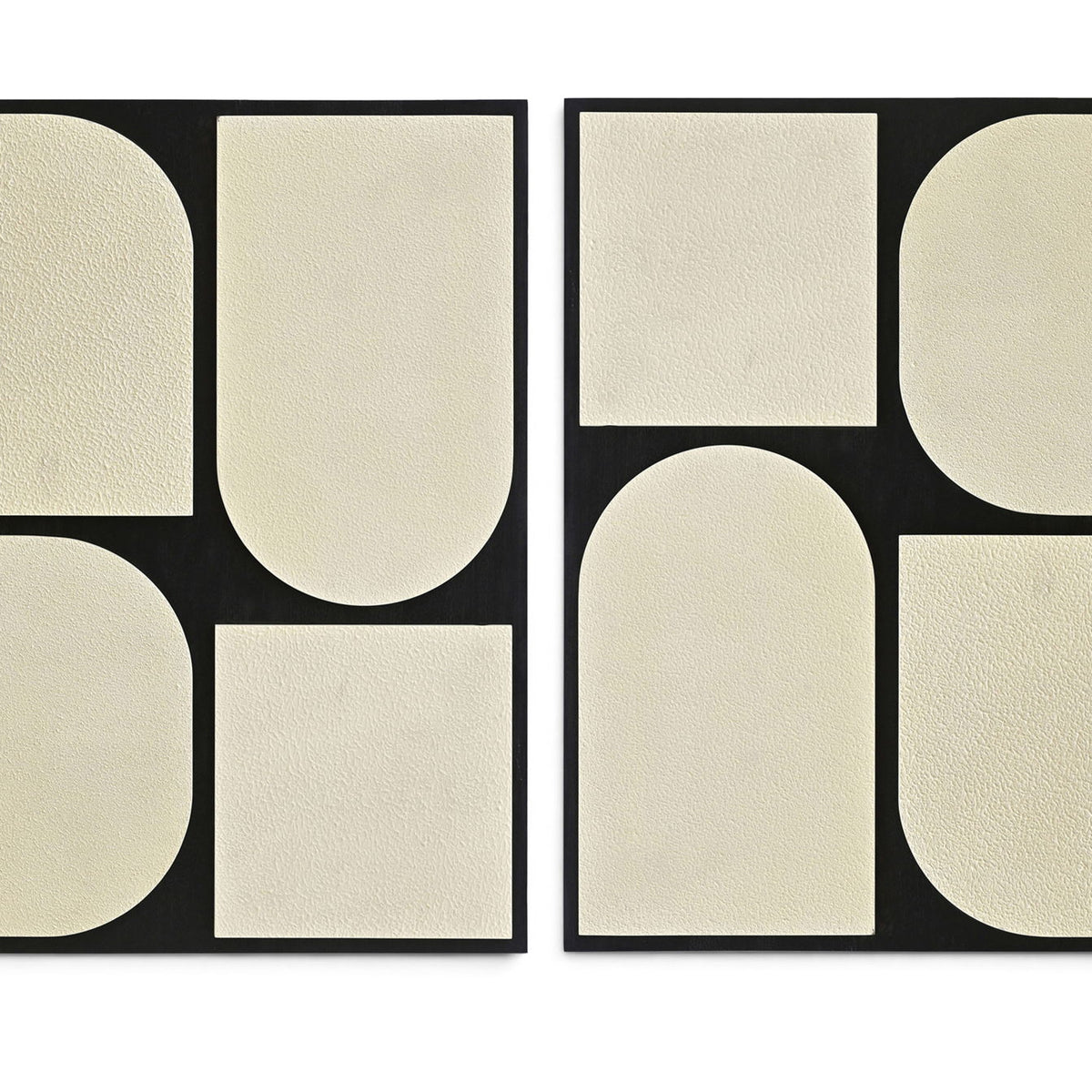 Two-piece wall art set with black frames and light beige abstract rounded panels.
