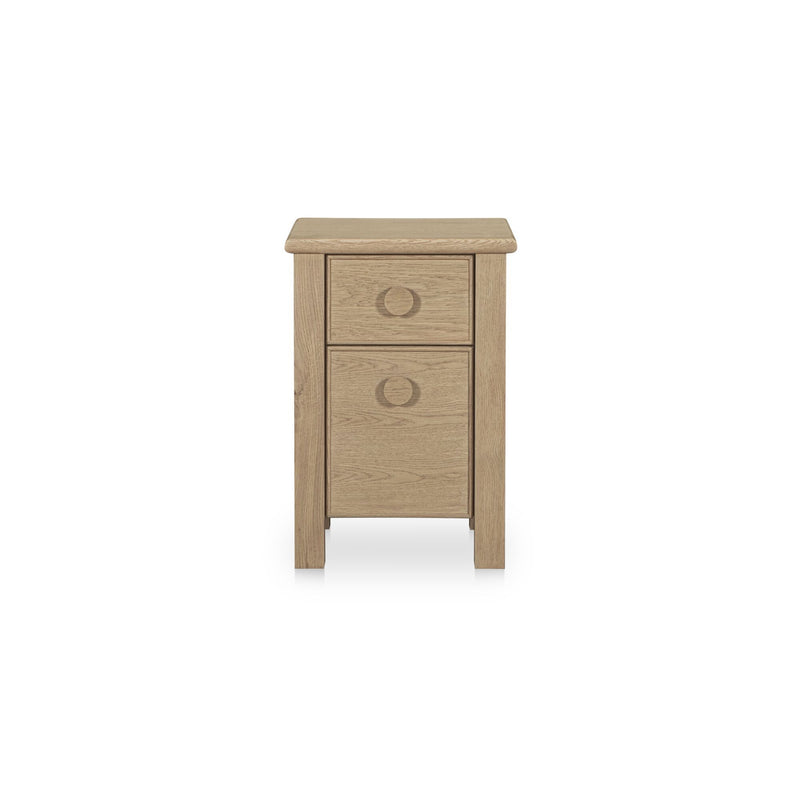 Natural wood small nightstand with two drawers and circular pulls.