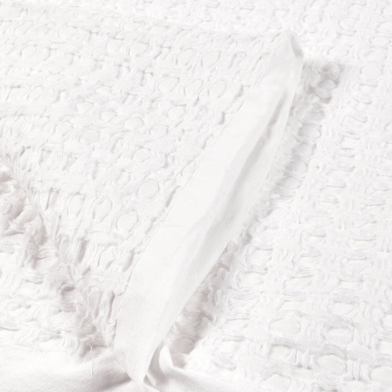 White textured sham pillow fabric with raised woven pattern