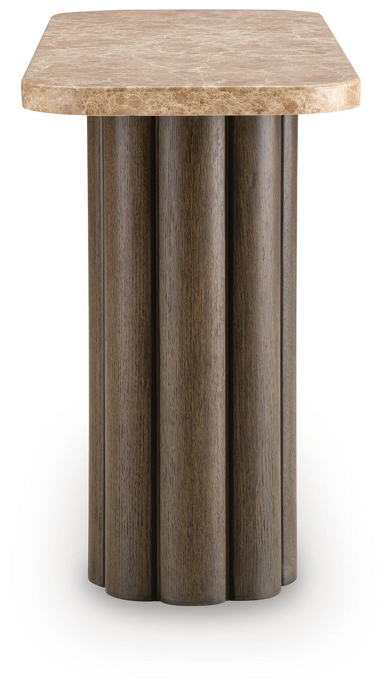 Rectangular table with speckled light stone top and dark fluted column base