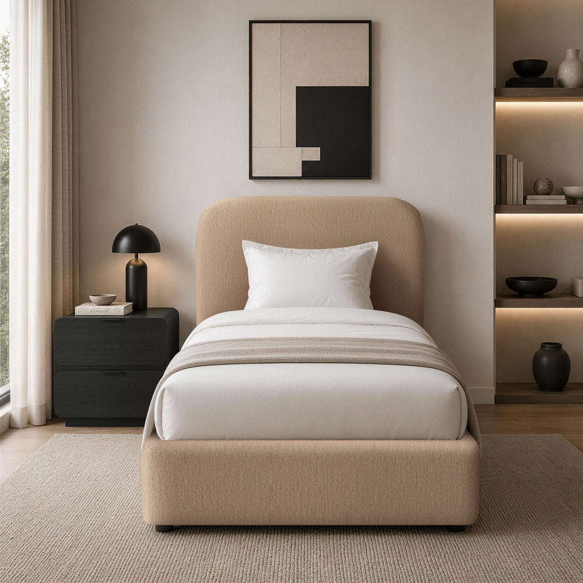 Light brown upholstered bed with rounded headboard and white bedding in a staged setting