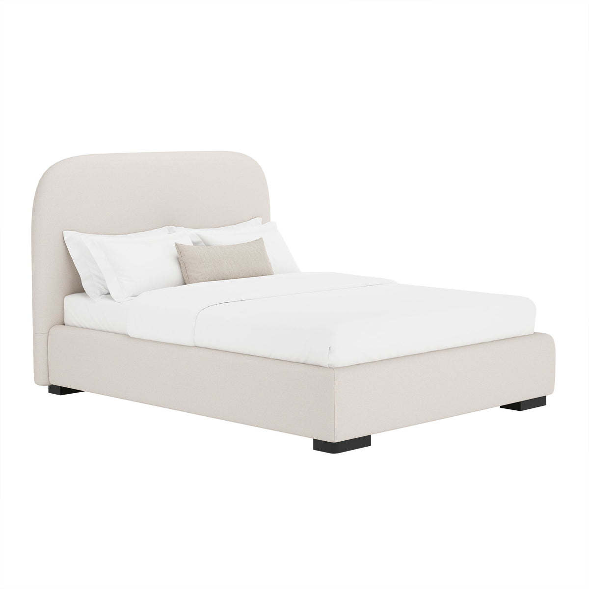 Beige upholstered bed with rounded headboard and low footboard, neatly made with pillows