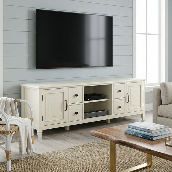 White wide TV stand with paneled doors, drawers, and open media shelves