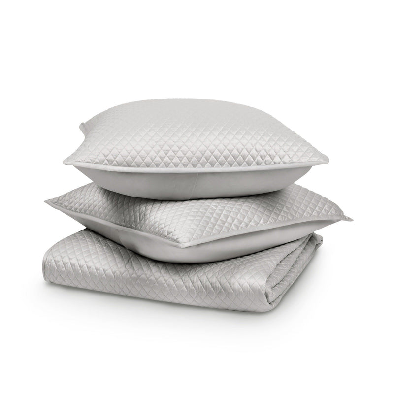 White diamond-quilt pillow and comforter set, stacked close-up