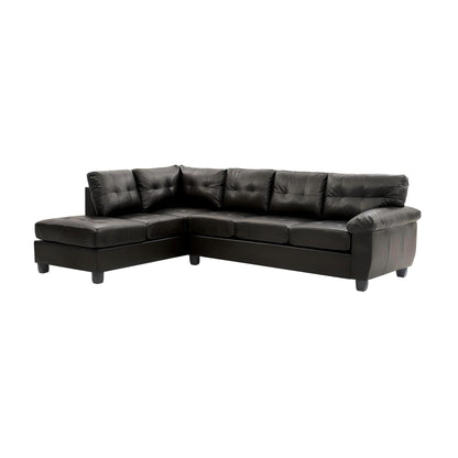 Black faux leather sectional sofa with tufted back and chaise corner, low block arms