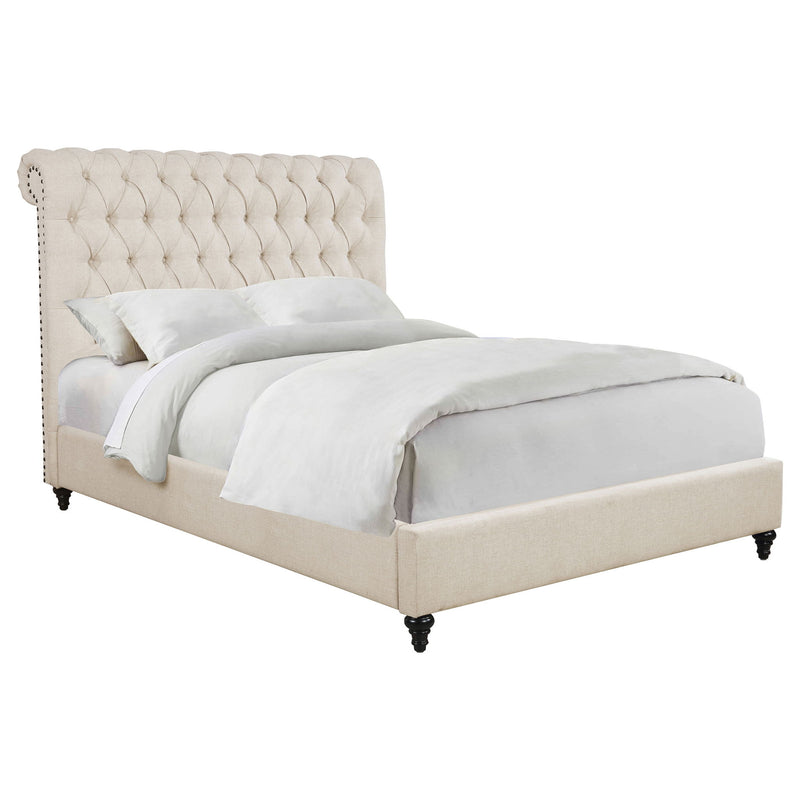 Beige tufted upholstered bed with rolled back headboard and upholstered footboard