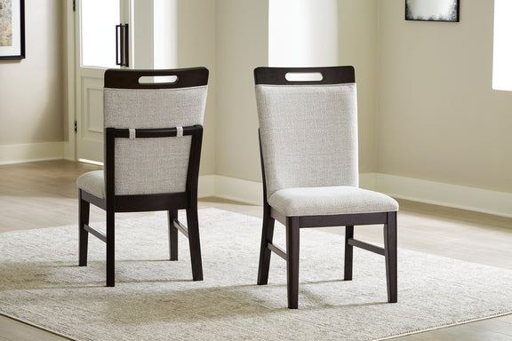 Set of 2 upholstered dining side chairs with light gray seats on rug