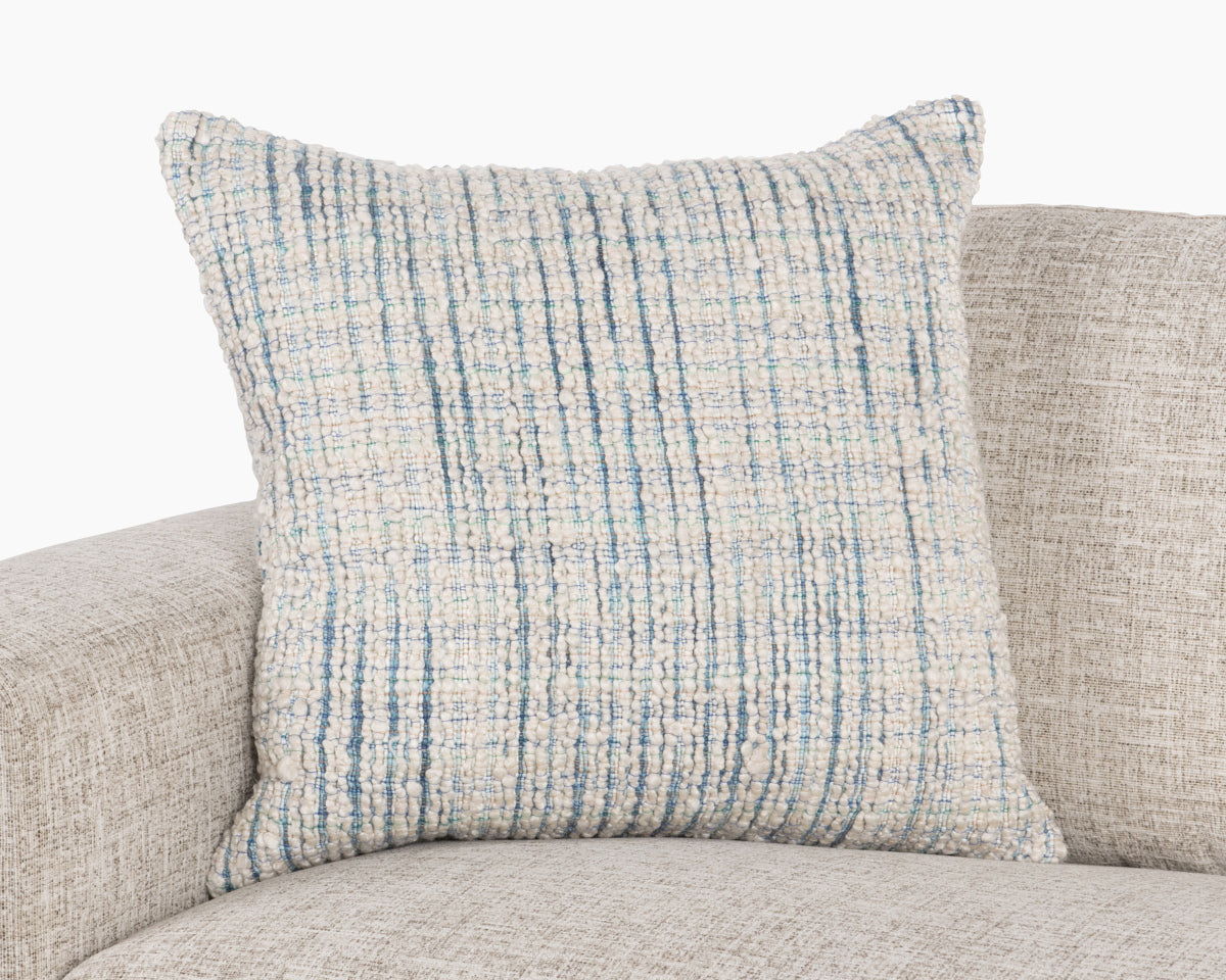 Blue textured woven throw pillow with stitched grid pattern, square