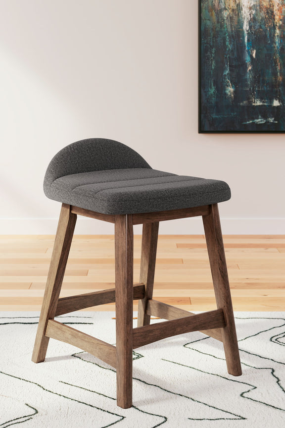 Upholstered barstool with charcoal gray fabric cushioned seat and curved back, wooden base