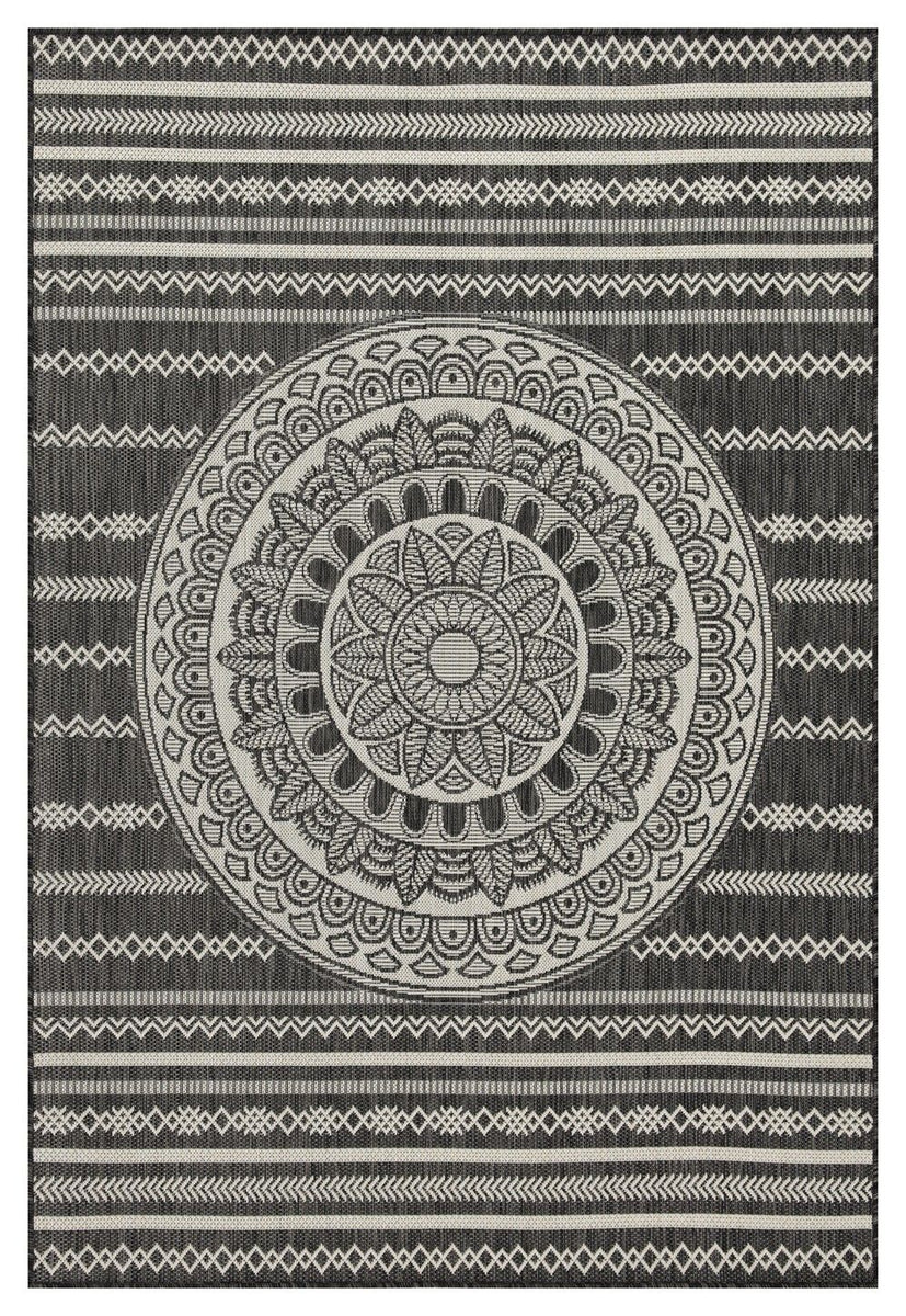 Indoor/outdoor area rug with dark and light gray circular mandala and geometric border