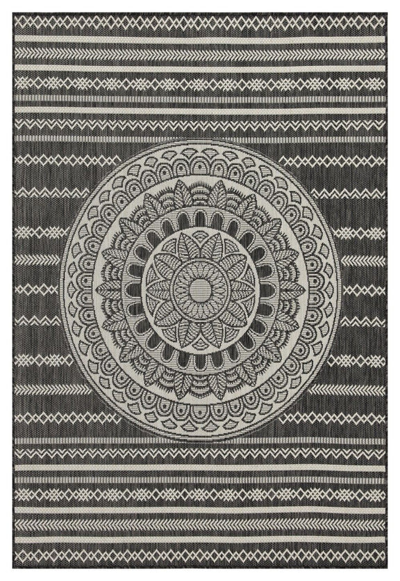 Indoor/outdoor area rug with dark and light gray circular mandala and geometric border