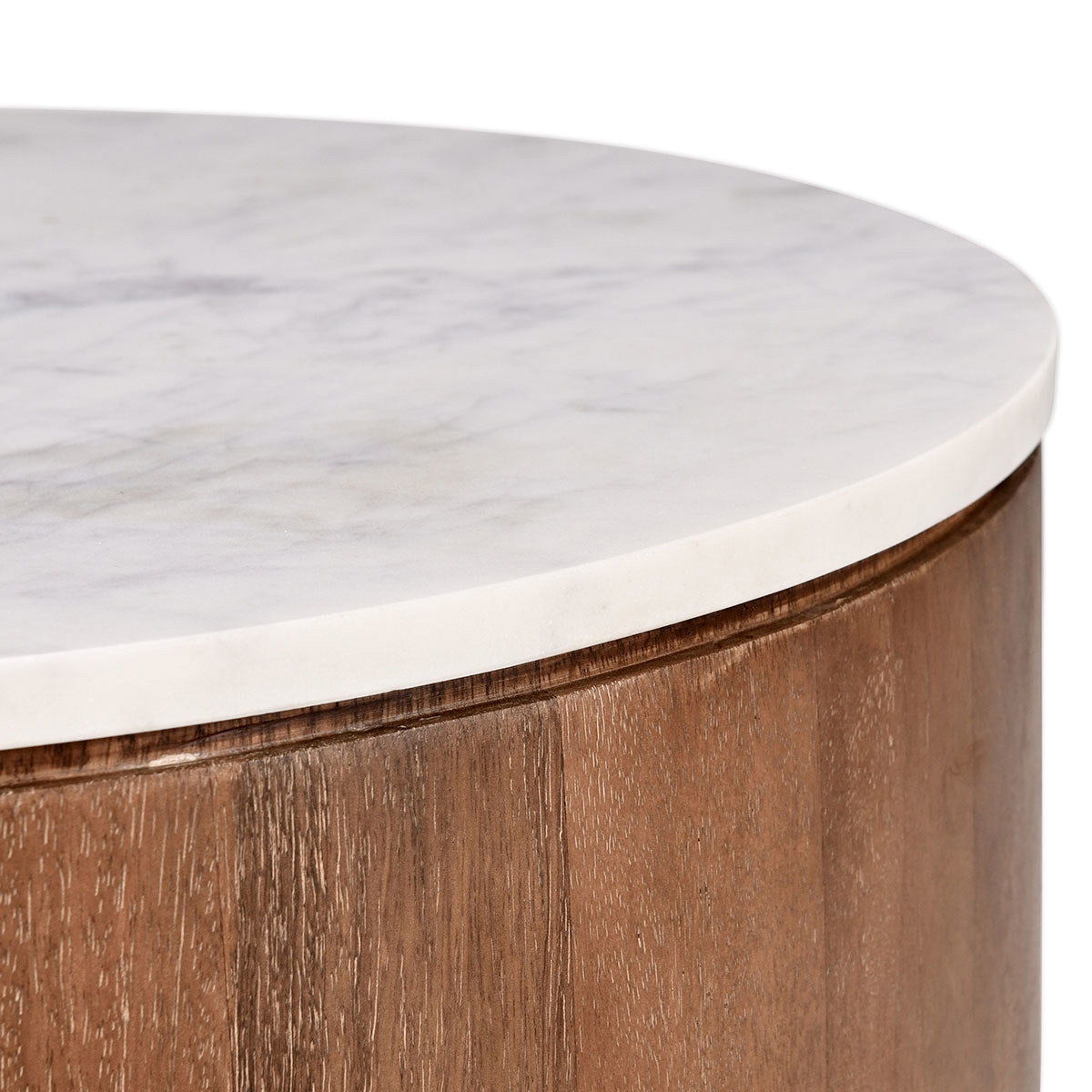 Close-up of white marble-look top and umber wood side with dark trim edge.