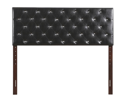 Black tufted headboard with diamond button details and sparkling nail accents