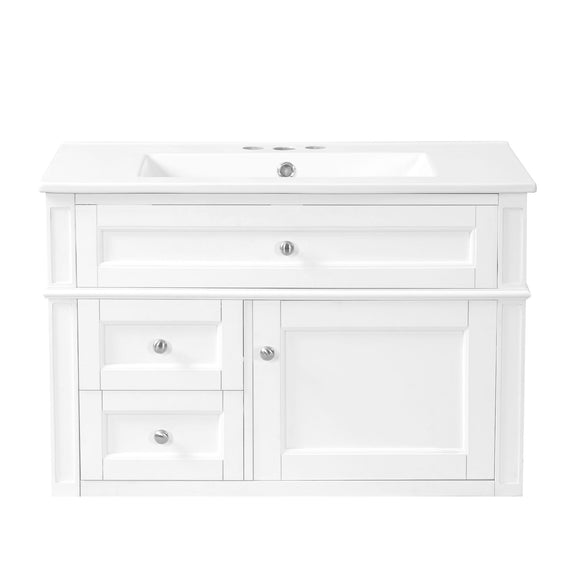 White wall-mounted bathroom vanity with integrated sink, two drawers, tip-out drawer and cabinet door.