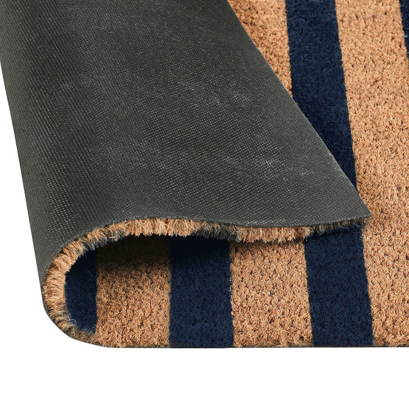 Rolled doormat edge with dark backing and navy, brown, and tan stripes.