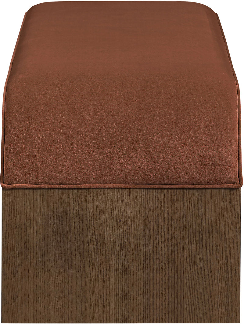 Dark red velvet bench cushion on dark wood base with stitched seat edges